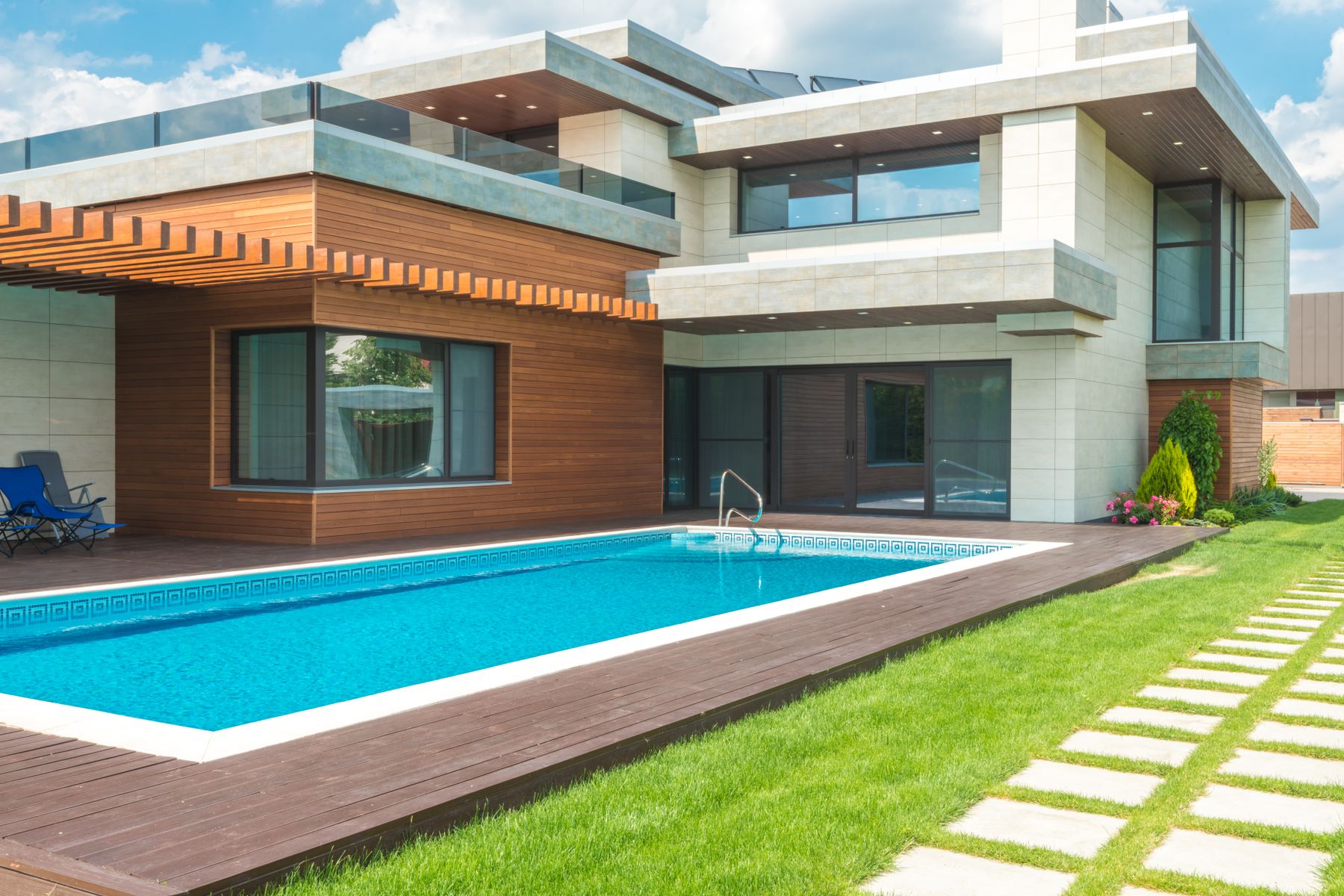 Illustrative modern villa with a pool and hillside setting