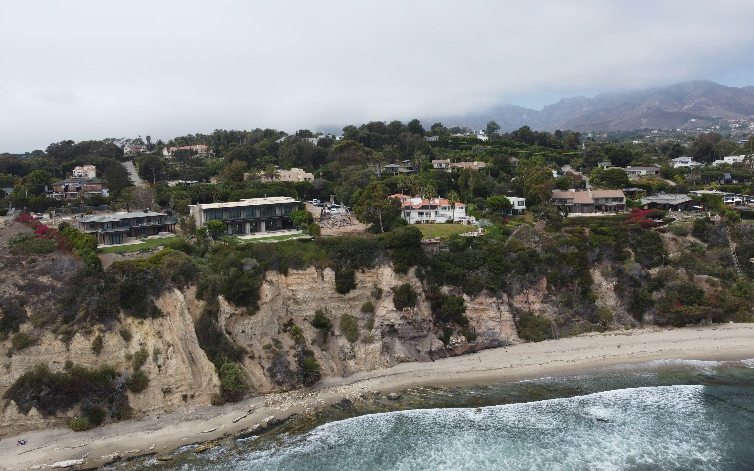 Illustrative aerial view of Point Dume coastline and estate homes